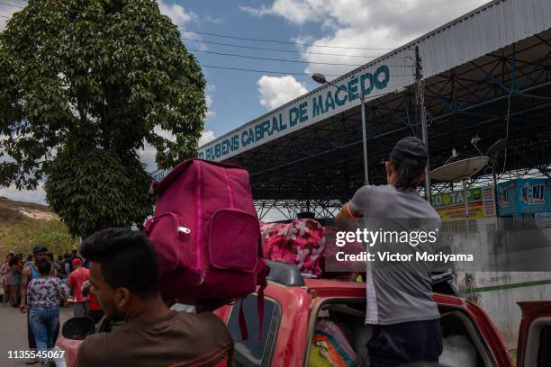 Venezuelans load cars with goods and food in Brazil before returning to Venezuela on April 6, 2019 in Pacaraima, Brazil. Although the border is...