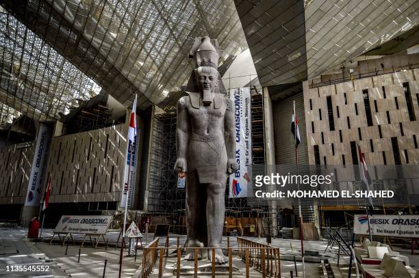 This picture taken on April 7, 2019 shows the colossus of ancient Egyptian Pharaoh Ramesses II, at its permanent display spot in the newly-built...