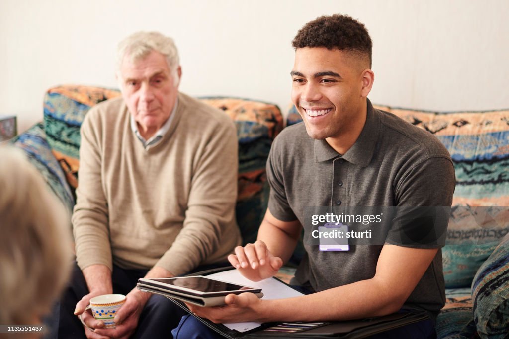 Client With Helper Housing Support Worker With Clients High-Res Stock Photo - Getty Images