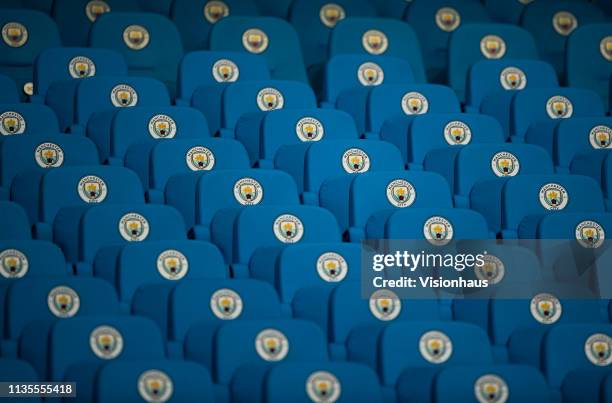 Manchester City seats showing the club crest before the UEFA Champions League Round of 16 Second Leg match between Manchester City v FC Schalke 04 at...