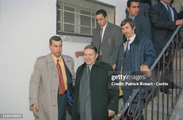 Abdelaziz Bouteflika and his brother Saïd behind him on the right during a campaign meeting in the town of Anaba, Algeria.