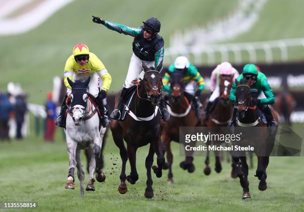 Jockey Nico de Boinville celebrates as he rides Altior to victory during the Betway Queen Mother Champion Chase on Ladies Day of the Cheltenham...