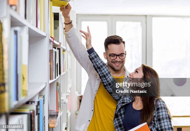 Reaching Books Reaching Book Shelf Photos and Premium High Res Pictures - Getty Images