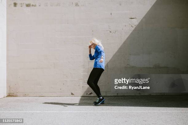 kvinnlig senior dansare på los angeles park - old woman dancing bildbanksfoton och bilder