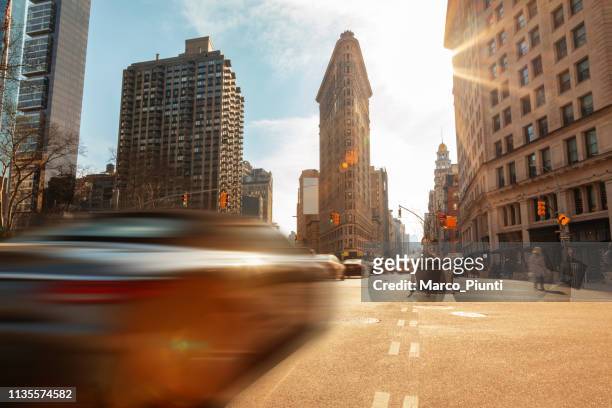 the flatiron building, new york city - low angle view street stock pictures, royalty-free photos & images