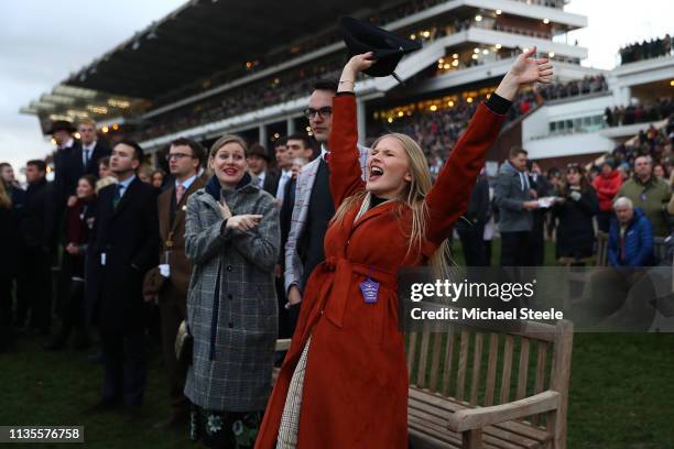 Lady racegoer adds vocal support during the last race on Ladies Day of the Cheltenham Festival at Cheltenham Racecourse on March 13, 2019 in...