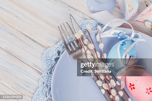 Easter table setting with willow branches and cutlery Easter table setting with willow branches and cutlery