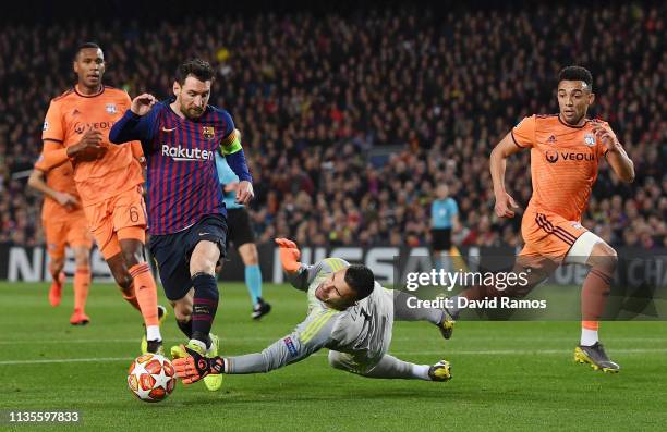 Lionel Messi of Barcelona is foiled by Anthony Lopes of Olympique Lyonnais during the UEFA Champions League Round of 16 Second Leg match between FC...