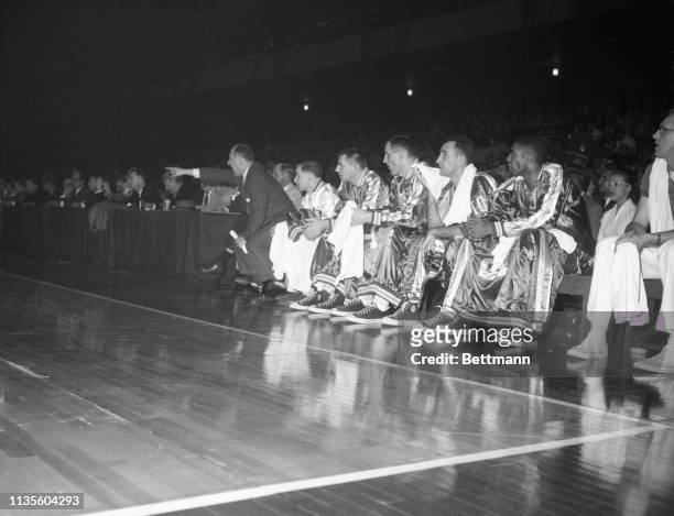 Boston coach Red Auerbach yells and points to call attention to some rule infraction during NBA playoffs against St. Louis Hawks.