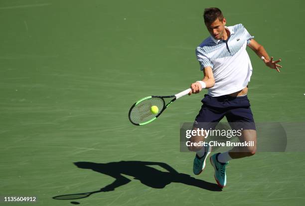 Filip Krajinovic of Serbia plays a forehand against Rafael Nadal of Spain during their men's singles fourth round match on day ten of the BNP Paribas...