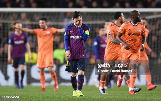Lionel Messi of Barcelona reacts as Lucas Tousart of Olympique Lyonnais scores his team's first goal during the UEFA Champions League Round of 16...