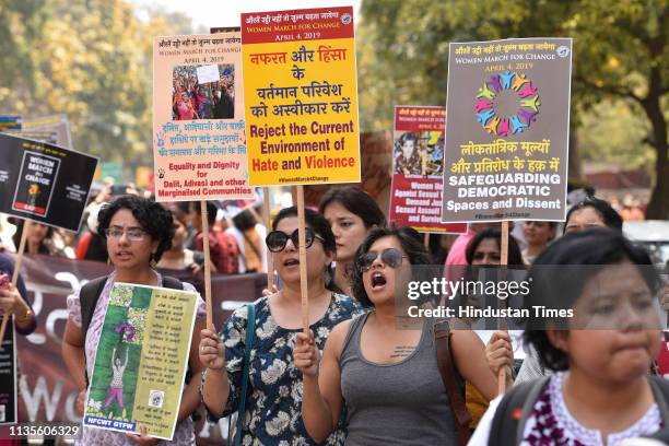 Women members of various groups hold placards and shout slogans against BJP government demanding equality and dignity for all marginalised...