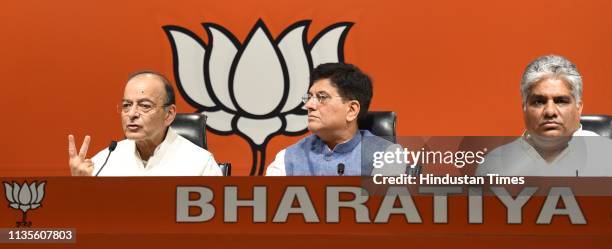 Union Finance Minister Arun Jaitley, Union Railways Minister Piyush Goyal and BJP leader Bhupender Yadav during the launch of the party's election...