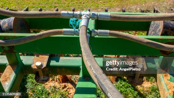 hydraulic connections in an agricultural machine - hose stock pictures, royalty-free photos & images