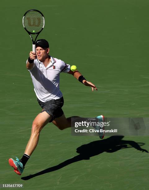 Kyle Edmund of Great Britain plays a forehand against Roger Federer of Switzerland during their men's singles fourth round match on day ten of the...