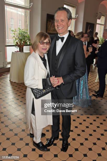 Joan Washington and Richard E. Grant attend The Olivier Awards 2019 with Mastercard at The Royal Albert Hall on April 7, 2019 in London, England.