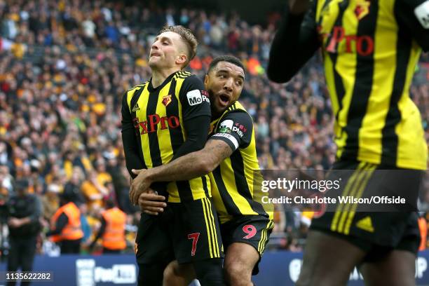 Gerard Deulofeu of Watford celebrates scoring their 3rd goal calmly even as Troy Deeney rushes to pick him up during the FA Cup Semi Final match...