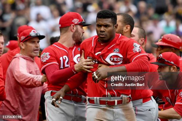 Yasiel Puig of the Cincinnati Reds is restrained by Matt Kemp after benches clear in the fourth inning during the game against the Pittsburgh Pirates...
