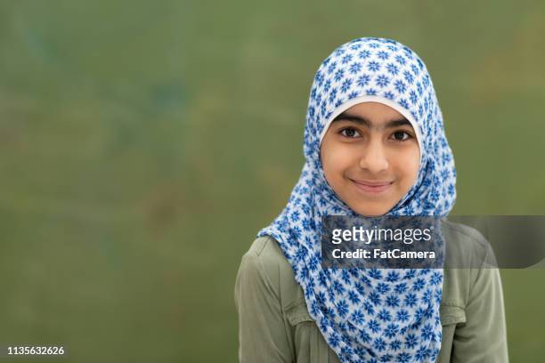 smiling muslim girl portrait - girl scarf stock pictures, royalty-free photos & images