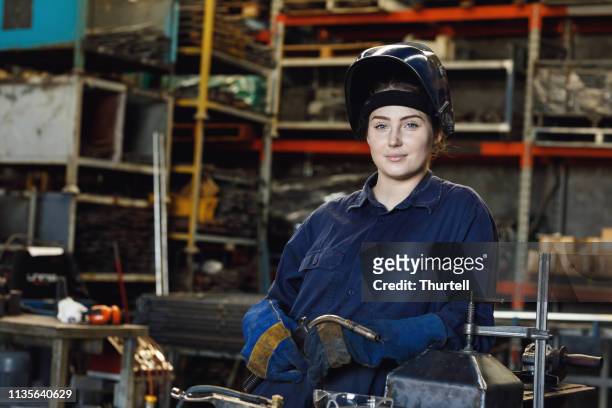 young australian female trainee welder - trade union stock pictures, royalty-free photos & images