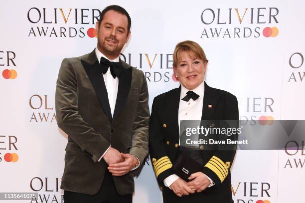 Danny Dyer and Cunard Captain Inger Klein Thorhauge pose in the press room at The Olivier Awards 2019 with Mastercard at The Royal Albert Hall on...