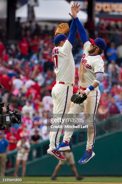Rhys Hoskins of the Philadelphia Phillies celebrates with Bryce Harper after the game against the Minnesota Twins at Citizens Bank Park on April 7,...
