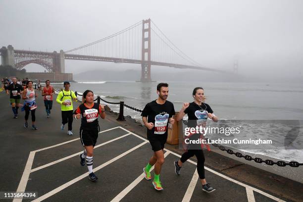 Runners race along the waterfront during the United Airlines Rock 'N' Roll Half Marathon San Francisco on April 7, 2019 in San Francisco, California.