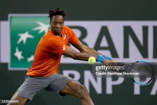 Gael Monfils of France returns a shot to Philipp Kohlschreiber of Germany during the BNP Paribas Open at the Indian Wells Tennis Garden on March 13,...