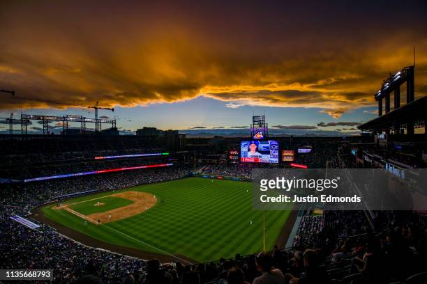 The sun sets over the stadium as the Colorado Rockies take on the Los Angeles Dodgers at Coors Field on April 7, 2019 in Denver, Colorado.