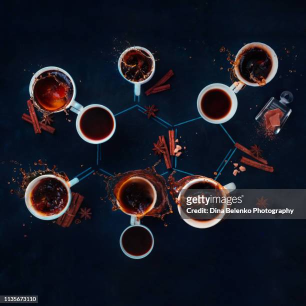 caffeine molecule made with coffee cups. creative coffee flat lay. science of coffee concept - koffeinmolekül stock-fotos und bilder