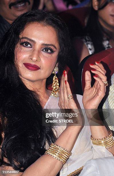 Indian Bollywood actress Rekha applauds at the Dadasaheb Phalke Awards 2011 ceremony in Mumbai on May 3, 2011. The Dadasaheb Phalke Award is India's...