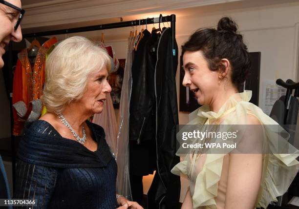 Camilla, Duchess of Cornwall talks to Patsy Ferran, winner of the best actress award, after attending the Olivier Awards at the Royal Albert Hall on...
