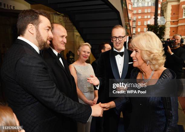 Camilla, Duchess of Cornwall meets host Jason Manford as she arrives to attend the Olivier Awards at the Royal Albert Hall on April 7, 2019 in London.