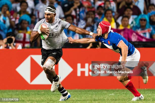 Gabin Villiere of France tries to put a tackle on Vilimoni Derenalagi of Fiji during the day three of the Cathay Pacific/HSBC Hong Kong Sevens Cup...