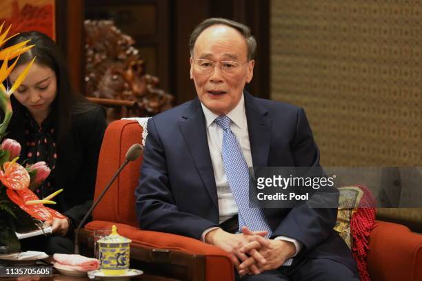 Karim Masssimov , Chairman of the National Security Council of Kazakhstan, attends a meeting with Chinese Vice President Wang Qishan on April 8, 2019...