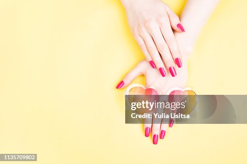 Woman hands on yellow background Woman hands on yellow background