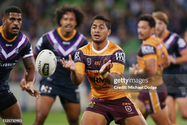 Anthony Milford of the Broncos passes the ball during the round one NRL match between the Melbourne Storm and the Brisbane Broncos at AAMI Park on...