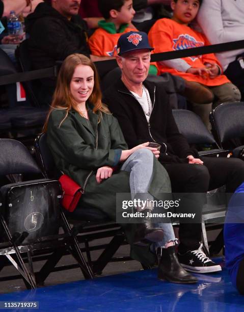 Anna McEnroe and John McEnroe attend Washington Wizards v New York Knicks game at Madison Square Garden on April 7, 2019 in New York City.