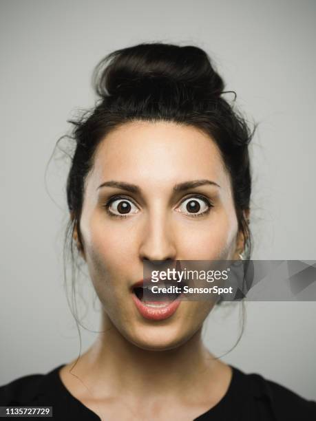 studio portrait of real mediterranean young woman with surprised expression - disbelief stock pictures, royalty-free photos & images