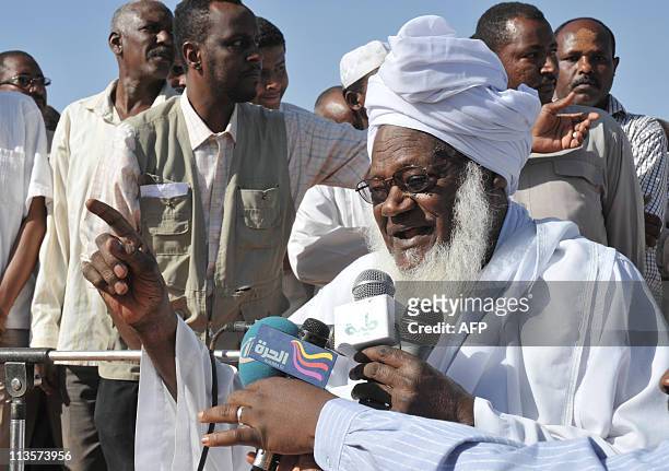 Zaid Mohammed Hamza, the head a local Sudanese Islamist group, leads prayers on May 3 in Khartoum, in remembrance of the late Al-Qaeda mastermind...