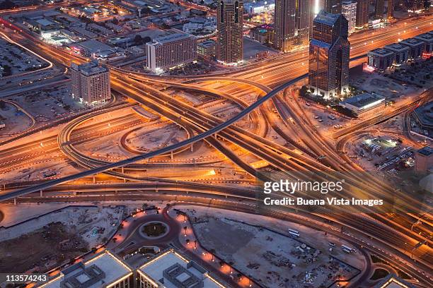 roads crossing downtown dubai - abu dhabi buildings stock pictures, royalty-free photos & images