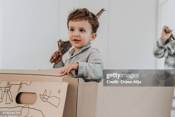 brothers playing with swords - fortress concept stock pictures, royalty-free photos & images