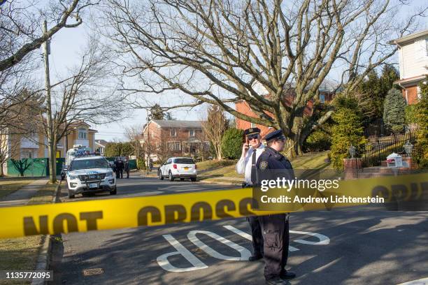 Police watch over the crime scene of the home of alleged Gambino family mafia crime boss Frank Cali on March 14, 2019 in the Todt Hill neighborhood...