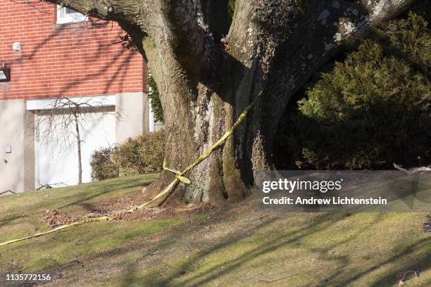 Police watch over the crime scene of the home of alleged Gambino family mafia crime boss Frank Cali on March 14, 2019 in the Todt Hill neighborhood...