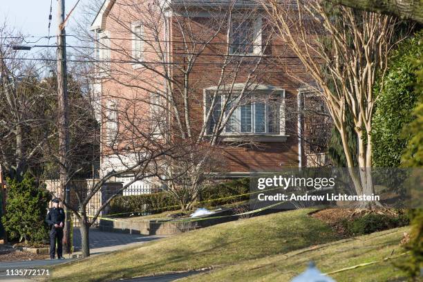 Police watch over the crime scene of the home of alleged Gambino family mafia crime boss Frank Cali on March 14, 2019 in the Todt Hill neighborhood...
