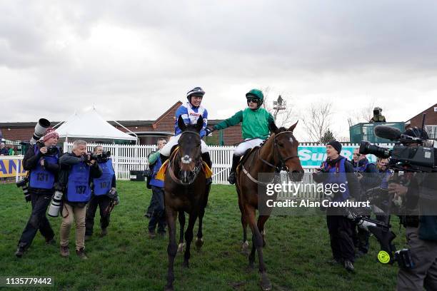 Bryony Frost celebrates after riding Frodon to win The Ryanair Chase at Cheltenham Racecourse on March 14, 2019 in Cheltenham, England.