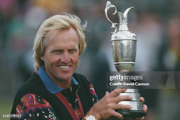 Greg Norman of Australia holds the Claret Jug after winning the 122nd Open Championship on 18th July 1993 at the Royal St George's Golf Club in...