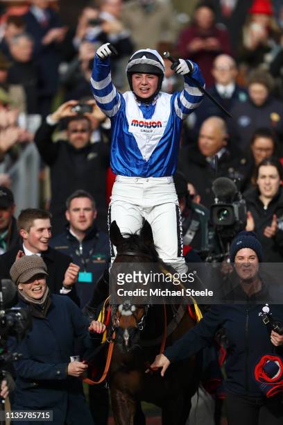 Jockey Bryony Frost celebrates victory as she rides Frodon during the Ryanair Chase race during St Patrick's Thursday at Cheltenham Racecourse on...