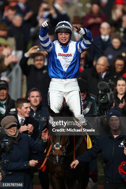 Jockey Bryony Frost celebrates victory as she rides Frodon during the Ryanair Chase race during St Patrick's Thursday at Cheltenham Racecourse on...