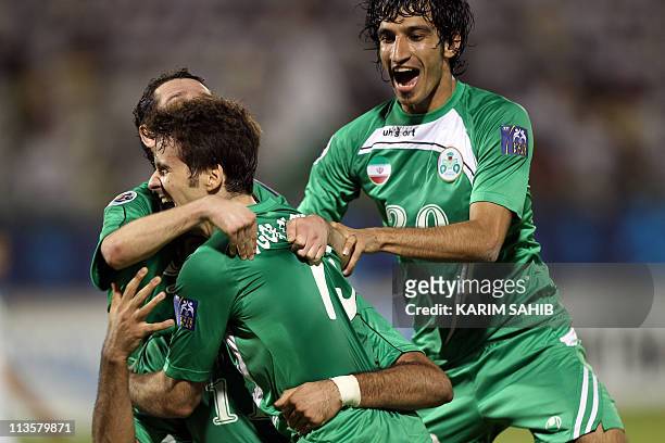 Iranian Zobahan Club players Igor Jose and Hossein Mahini celebrate a goal during their AFC Champions League Group D match against the Emirates club...